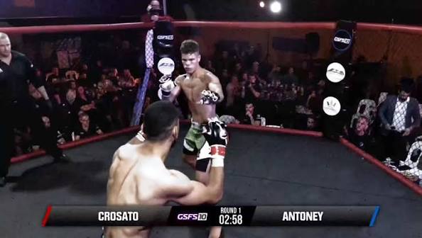Amateur boxing match, red corner exchanging punches with blue corner